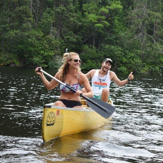 Two people canoeing in the Boundary Waters.