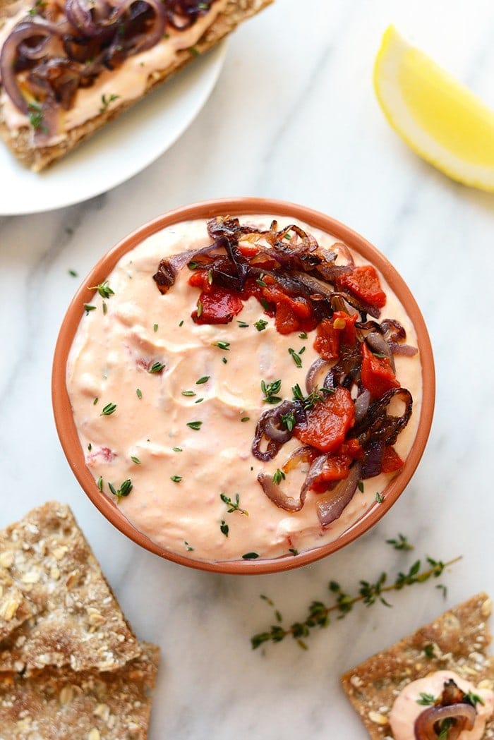 With Sunday football back in action, this Skinny Roasted Red Pepper and Goat Cheese Dip makes for the most perfect appetizer. It's made with a non-، Greek yogurt base, pureed roasted red peppers, and goat cheese! 