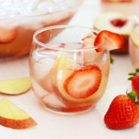 Strawberry-Peach Rosé Sangria with ice.