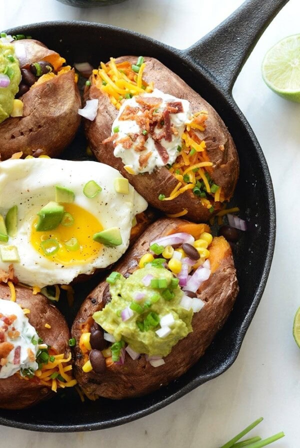 Mexican stuffed sweet potatoes with eggs and guacamole.