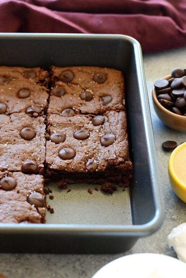 Chocolate brownies with cashew butter and chocolate chips.