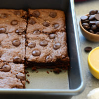 Cashew Butter Brownies with chocolate chips in a pan.