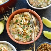 Four bowls of Mexican bean and cheese soup with a twist of white chicken.