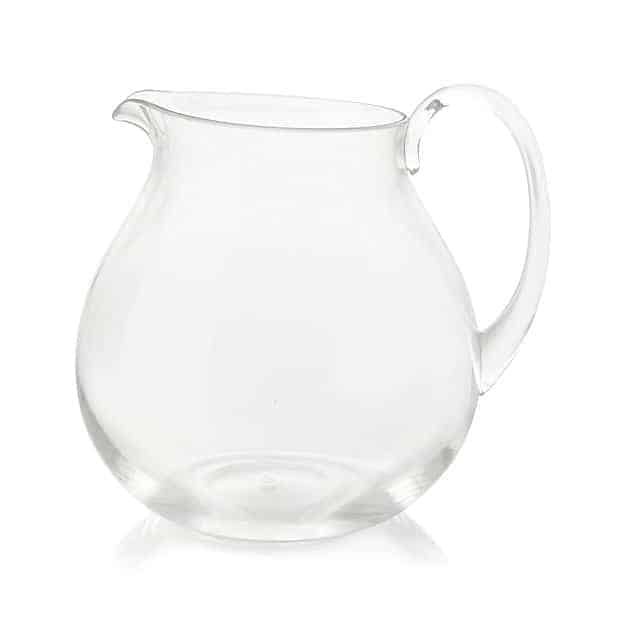 a clear glass pitcher on a white background, perfect for serving a refreshing hot toddy recipe.