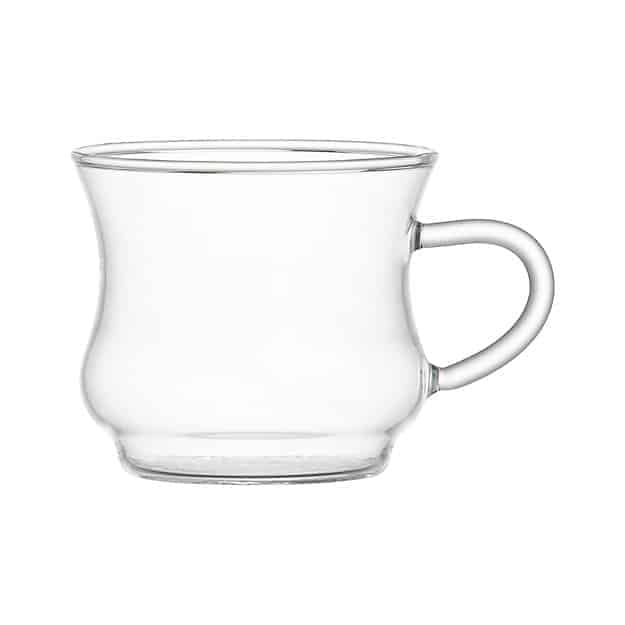 A clear glass cup on a white background, perfect for enjoying a hot toddy recipe.