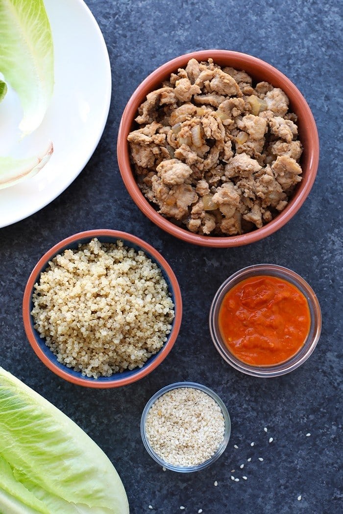 bowls of quinoa, chicken, Gochujong and sesame seeds
