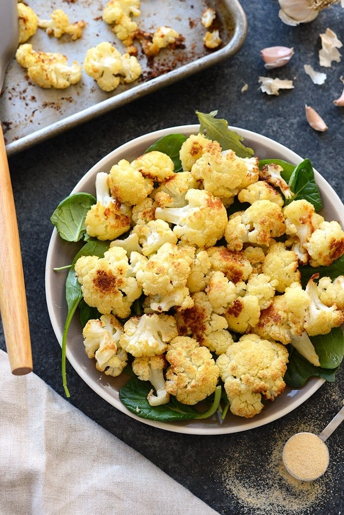 This Super Simple Garlic Roasted Cauliflower is the perfect flavor-packed, healthy side dish for any meal. It even makes for a great snack! 