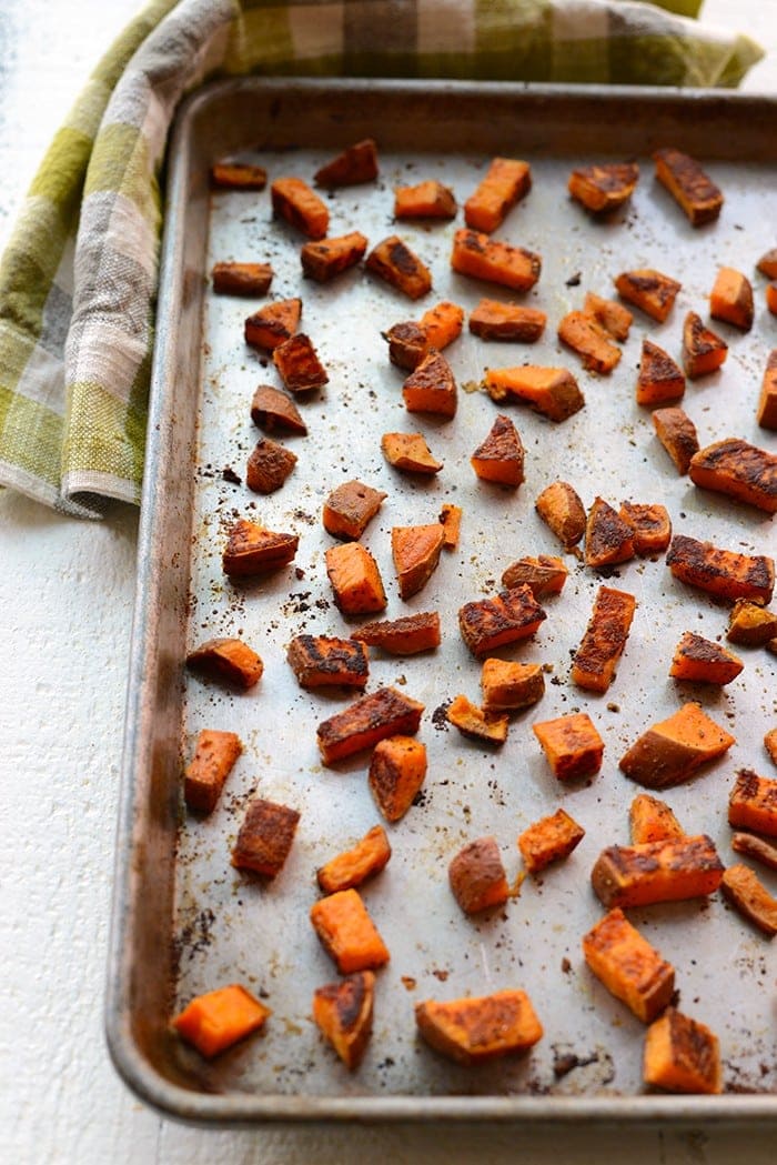 crispy roasted sweet potatoes on baking sheet