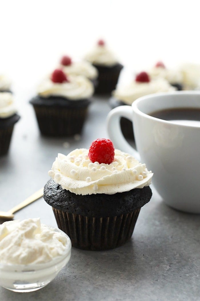 healthier chocolate cupcakes topped with a fresh raspberry