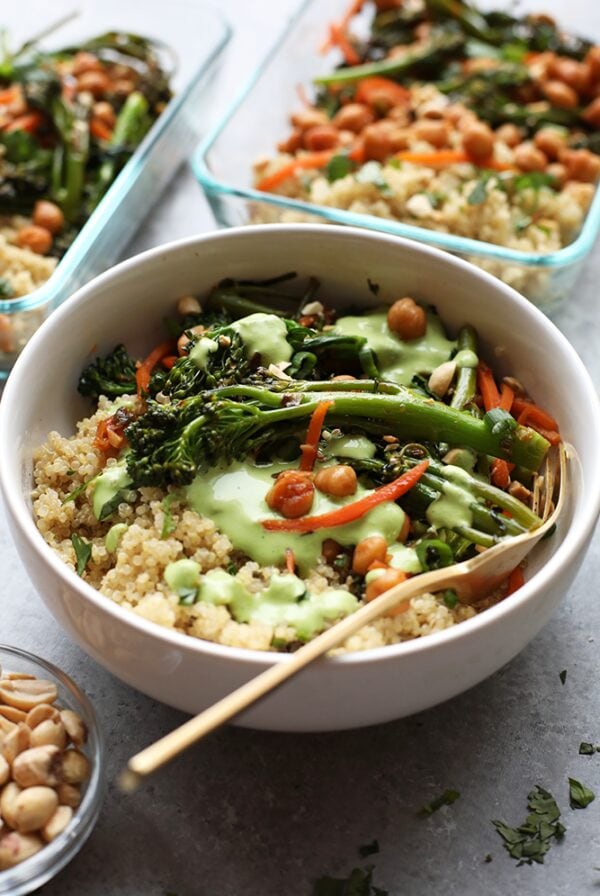 Vegetarian quinoa bowl with broccoli, carrots, and peanuts.