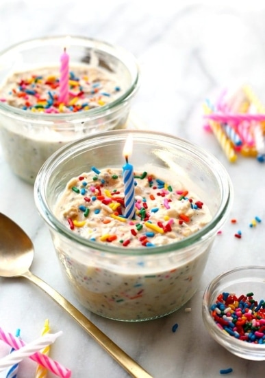 Two bowls of cake batter with candles and sprinkles transformed into delightful overnight oats.