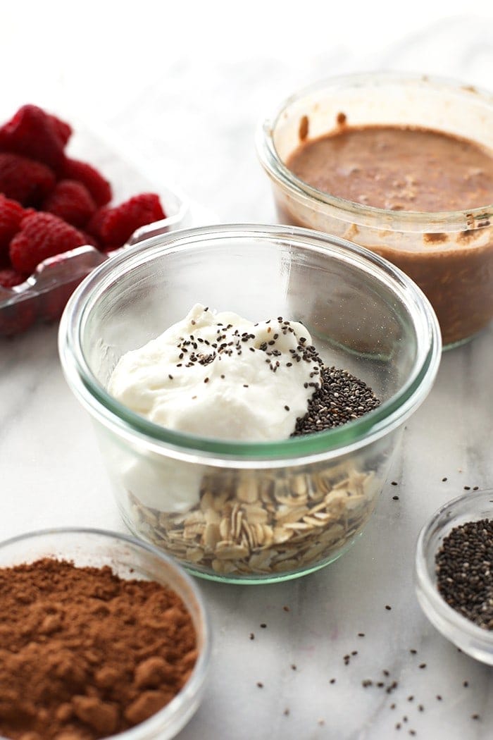 Nothing like cheesecake for breakfast. This Chocolate Raspberry Cheesecake Overnight Oatmeal recipe is prepped in less than 5 minutes so that you can have a healthy breakfast ready to go in seconds in the AM. 