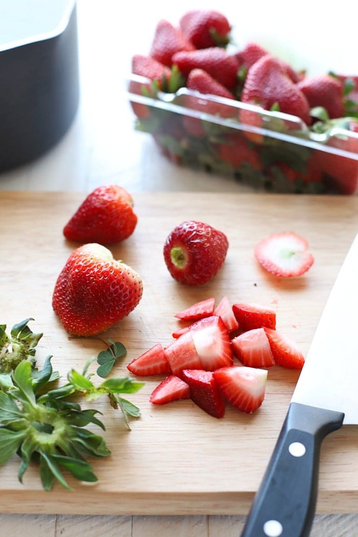 Strawberries on cutting board.