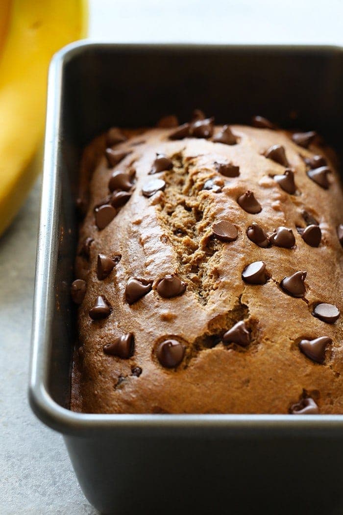 This Whole Wheat Coconut Oil Roasted Banana Bread is about to change you life. It's made with white whole wheat flour, roasted bananas, coconut oil, and dark chocolate chips.
