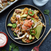 Mexican nachos on a plate with a fork.