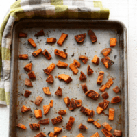 Sweet potato cubes on a baking sheet.