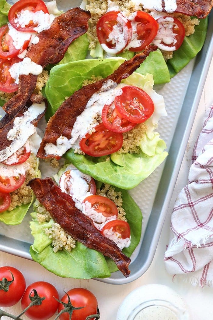 Ditch the bread and make these amazing BLT Quinoa Lettuce Wraps with a piece of bib lettuce and homemade healthy ranch instead! 