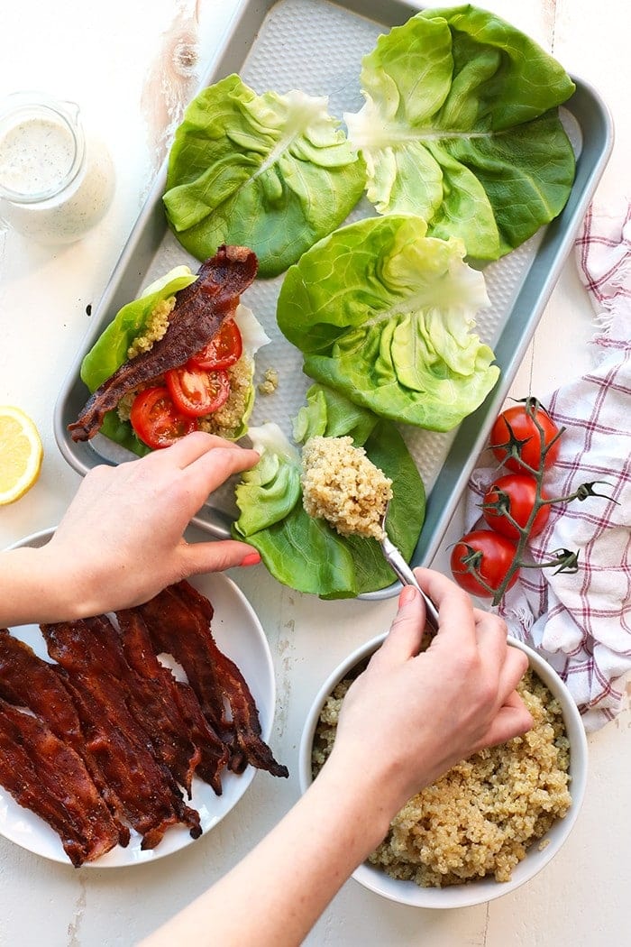 Ditch the bread and make these amazing BLT Quinoa Lettuce Wraps with a piece of bib lettuce and homemade healthy ranch instead! 