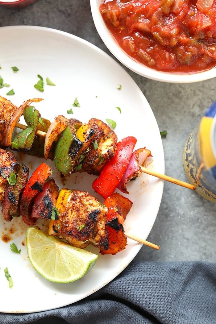 chicken fajita kabobs on plate.