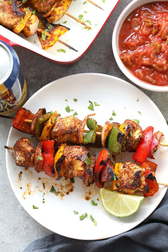 chicken fajita kabobs on plate.