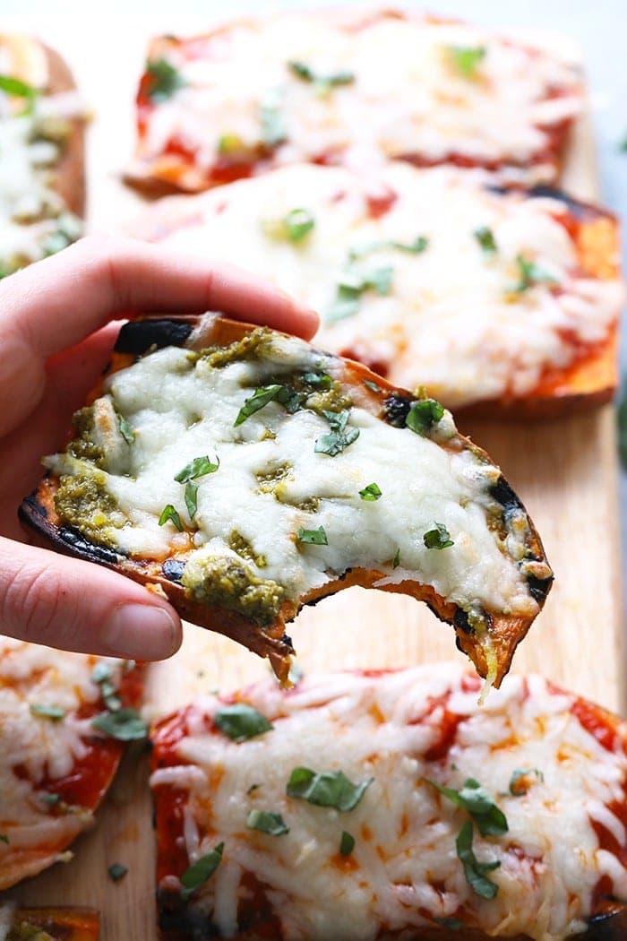Wow the fam with these amazing grilled sweet potato pizzas! All you need is sweet potatoes, your favorite marinara sauce or pesto, mozzarella, and your favorite pizza toppings for this healthy 30 minute meal.