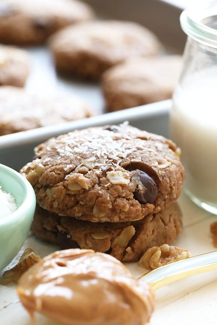 Looking to whip up a batch of cookies? Lighten things up with these crunchy on the outside, soft on the inside healthy vegan cowboy cookies! They're made with peanut butter, oats, coconut, and walnuts! 
