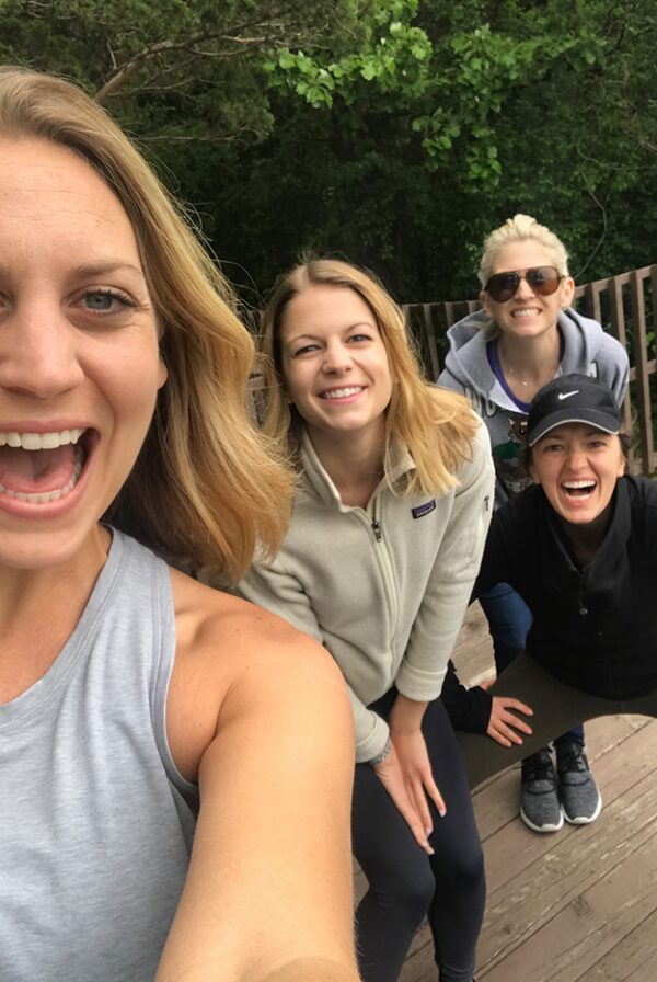 A group of women capturing their life lately in June 2017 by taking a selfie on a wooden deck.