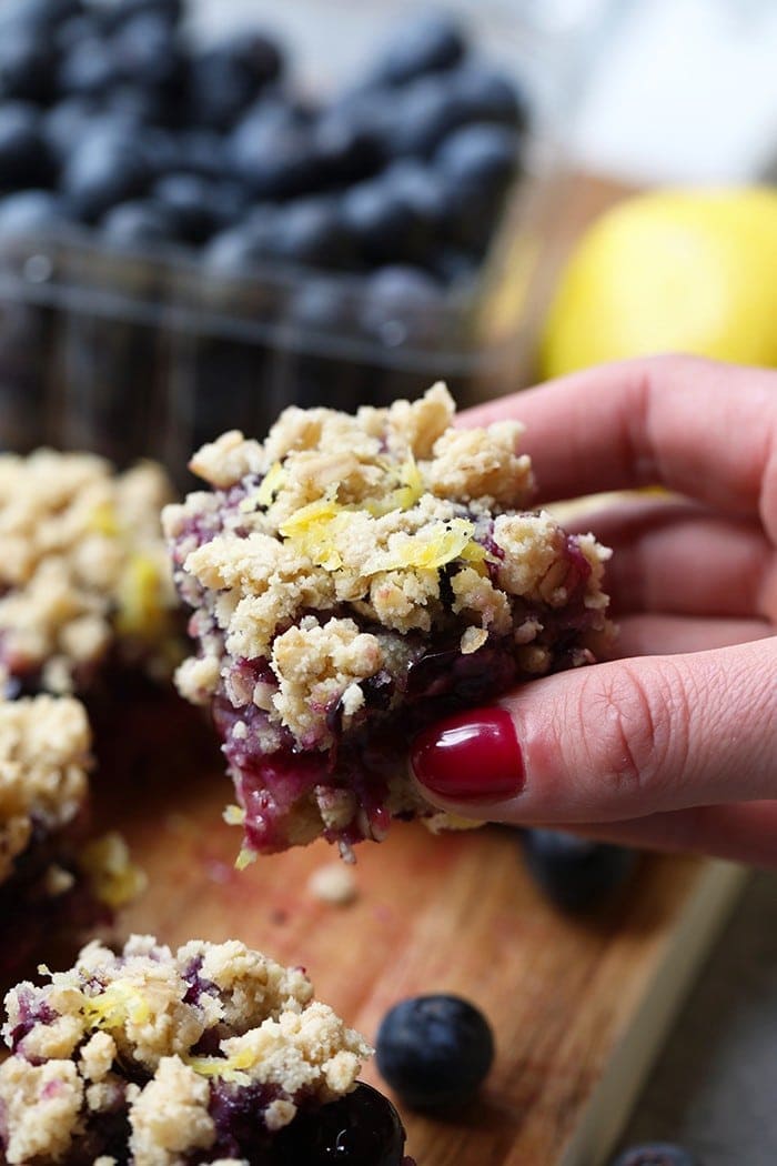 Holding crumble bar in a hand.