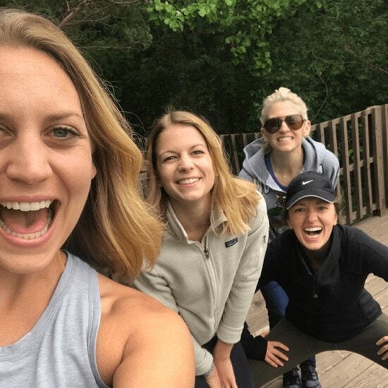 Four women posing for a selfie on a wooden deck, capturing Life Lately in June 2017.