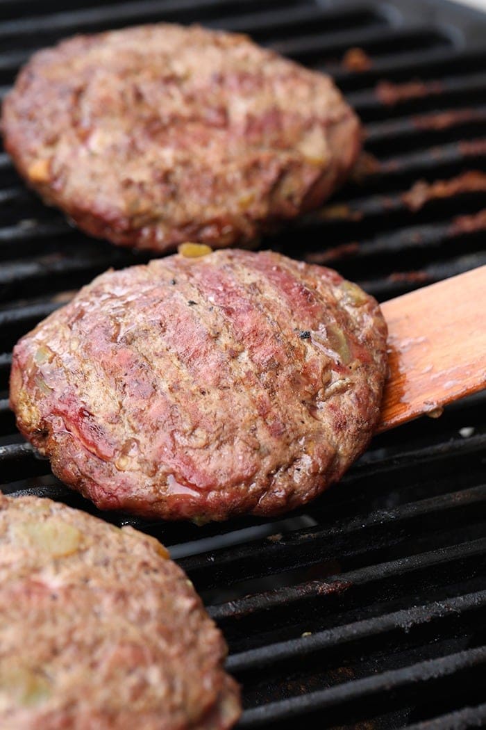 Juicy lucy burger on the grill