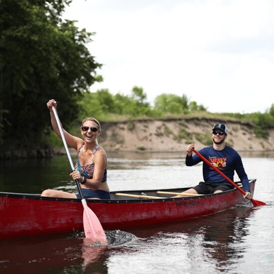 A couple canoeing on the Cannon River.