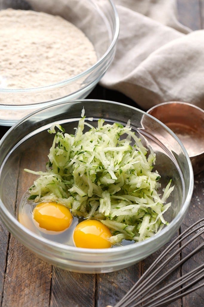 You will absolutely love this zucchini waffle recipe because it's made with whole wheat flour, shredded zucchini, coconut oil, and real maple syrup. shredded zucchini and eggs