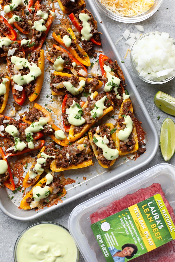 Ditch the chips for a healthier nacho and use mini bell peppers! These Fajita "Nachos" are cute, delicious, and healthy. They're made with mini bell peppers, lean ground beef, and avocado crema.