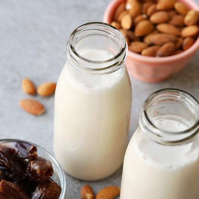How is almond milk made? Well, making the best homemade almond milk recipe is easier than you think. All you need is almonds, vanilla bean, dates, and a nut milk bag to make a vegan, gluten-free, and paleo-friendly Date Sweetened Homemade Almond Milk. 