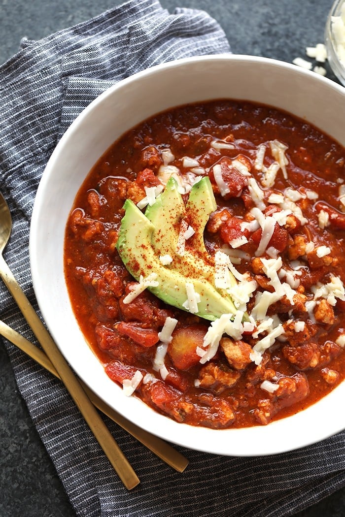 You're going to love this bean-less, paleo-friendly chili recipe! This Pumpkin Turkey Chili with Roasted Poblano Peppers is made with ground turkey, pumpkin puree, and roasted poblano peppers!