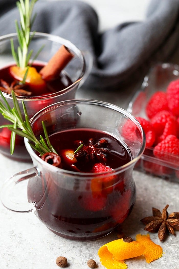 festive mulled wine in a mug with rosemary