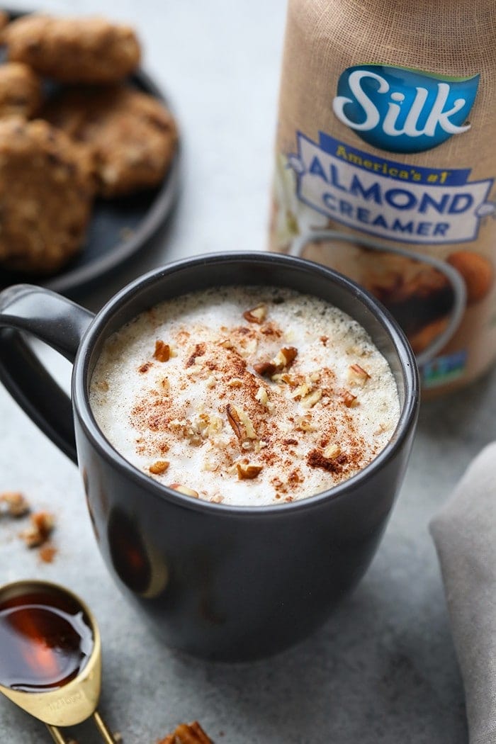 Who needs to go to a coffee shop when you can make your own luscious latte at home without an espresso machine! You're going to love this DIY Maple Pecan Latte made with cold brew and Vanilla Silk Almond Creamer.