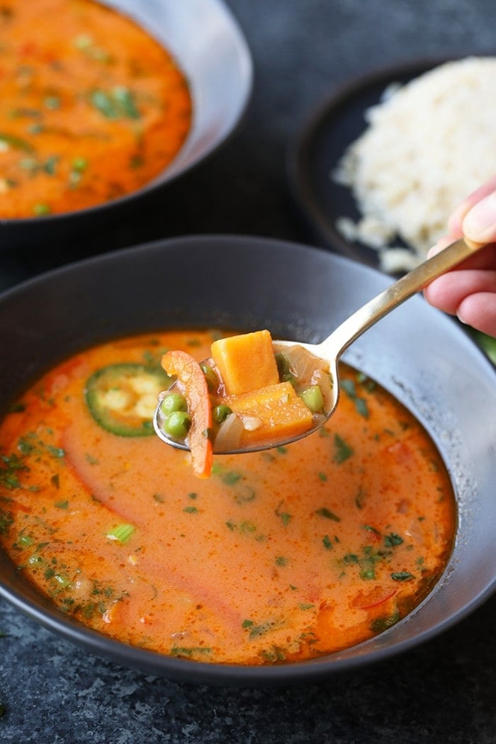 This Spicy Thai Coconut Curry Soup (Vegan!) is the perfect weeknight meal. It is packed with veggies, healthy fats, and a ton of flavor! It's ready in 30-minutes and is great for meal-prep throughout the week. 