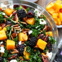 A butternut squash massaged kale salad with blackberries and walnuts.