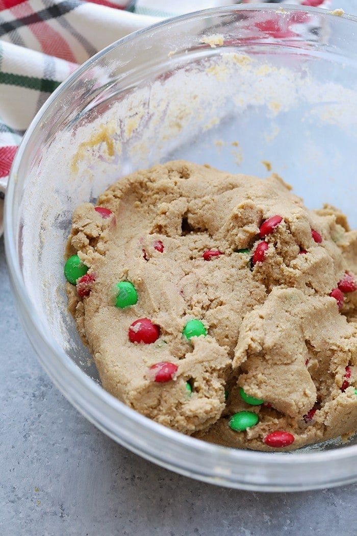 Spread a little holiday cheer with a cookie tin full of these Healthier M&M Cookies! These cookies are a must for the holiday season.