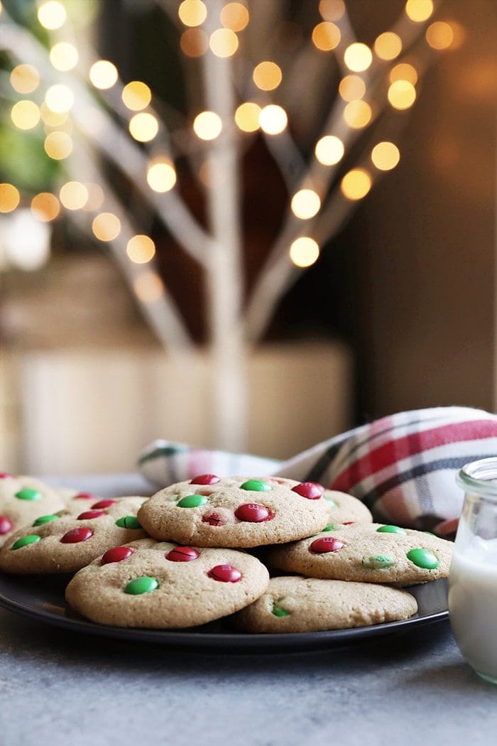 Spread a little holiday cheer with a cookie tin full of these Healthier M&M Cookies! These cookies are a must for the holiday season.