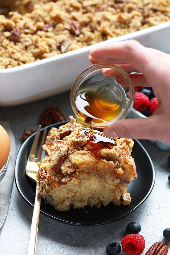 Pouring syrup on french toast bake