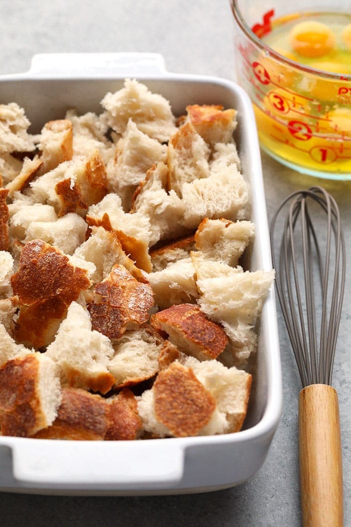 pieces of sourdough bread in casserole dish