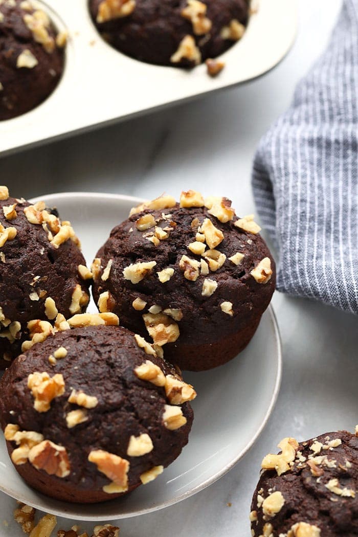 chocolate banana muffins with walnuts on a plate