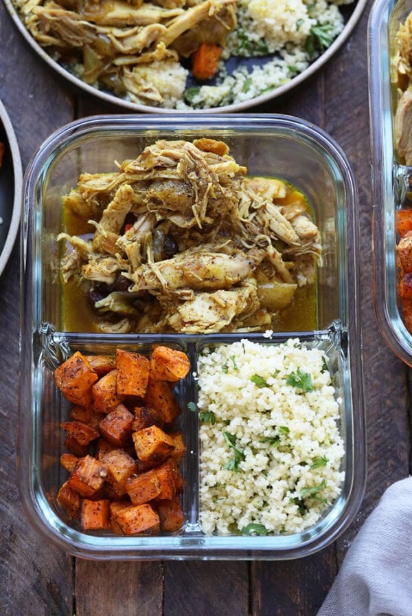 meal prep containers with Instant Pot chicken thighs, rice and sweet potatoes.