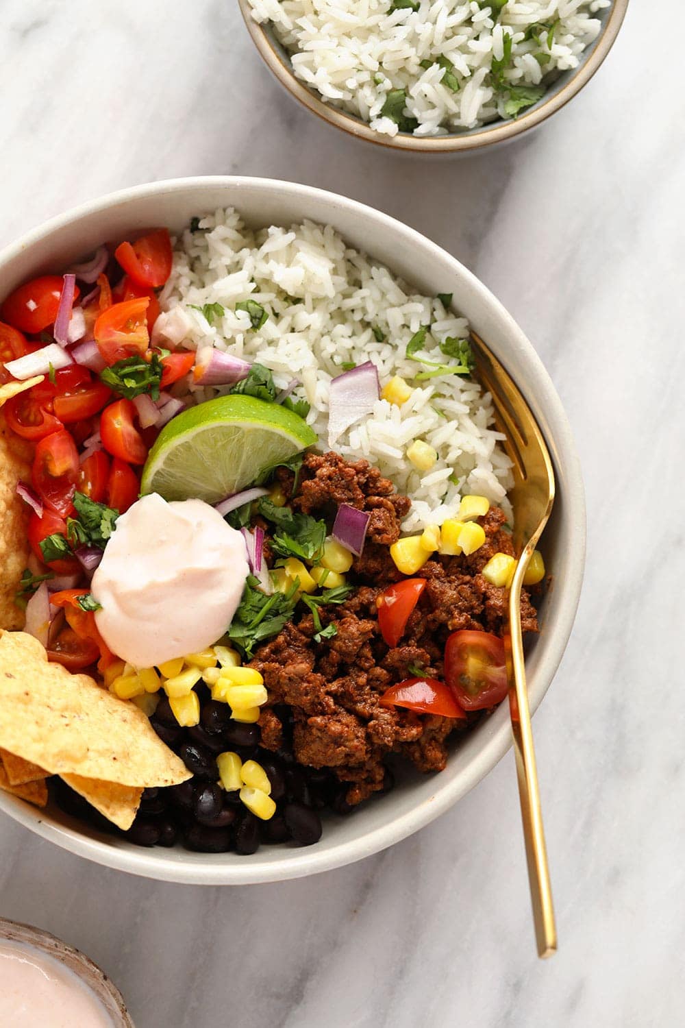 Taco bowl with ground beef and cilantro lime brown rice.