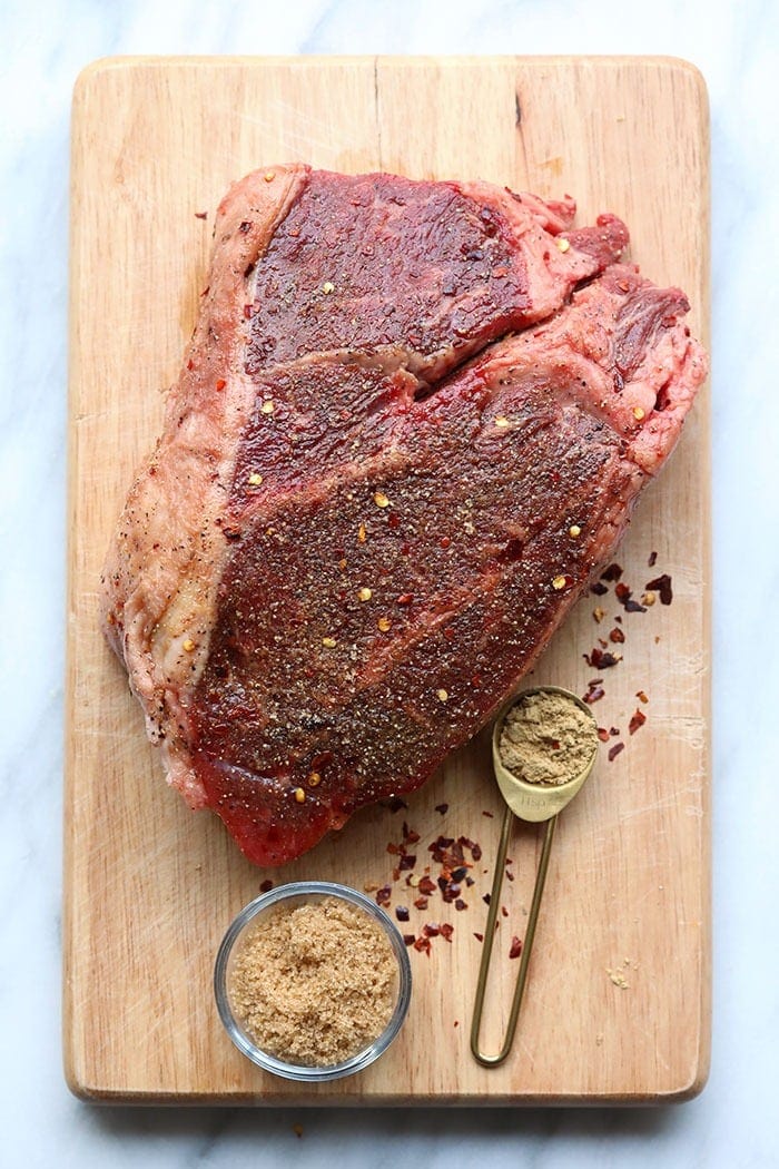 A chuck roast on a cutting board