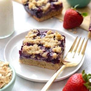 triple berry crumble bar on a plate