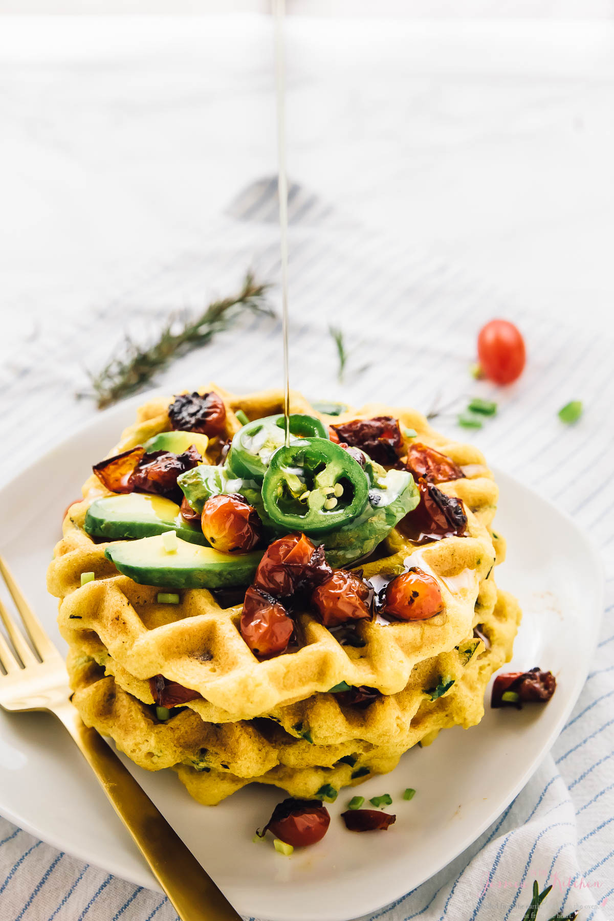 These Jalapeño Cornbread Waffles are the ultimate savoury waffles! They’re made with roasted garlic, rosemary, and are perfect for brunch or breakfast for dinner! Jalapeño Cornbread Waffles with Roasted Garlic and Rosemary
