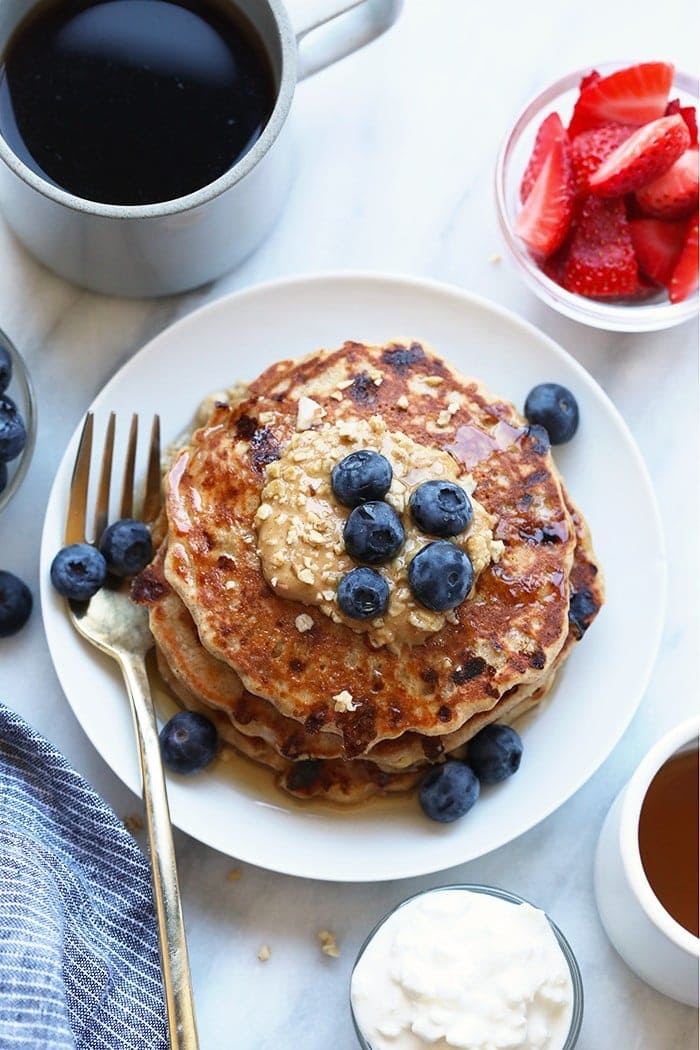 protein pancakes on plate with peanut butter.